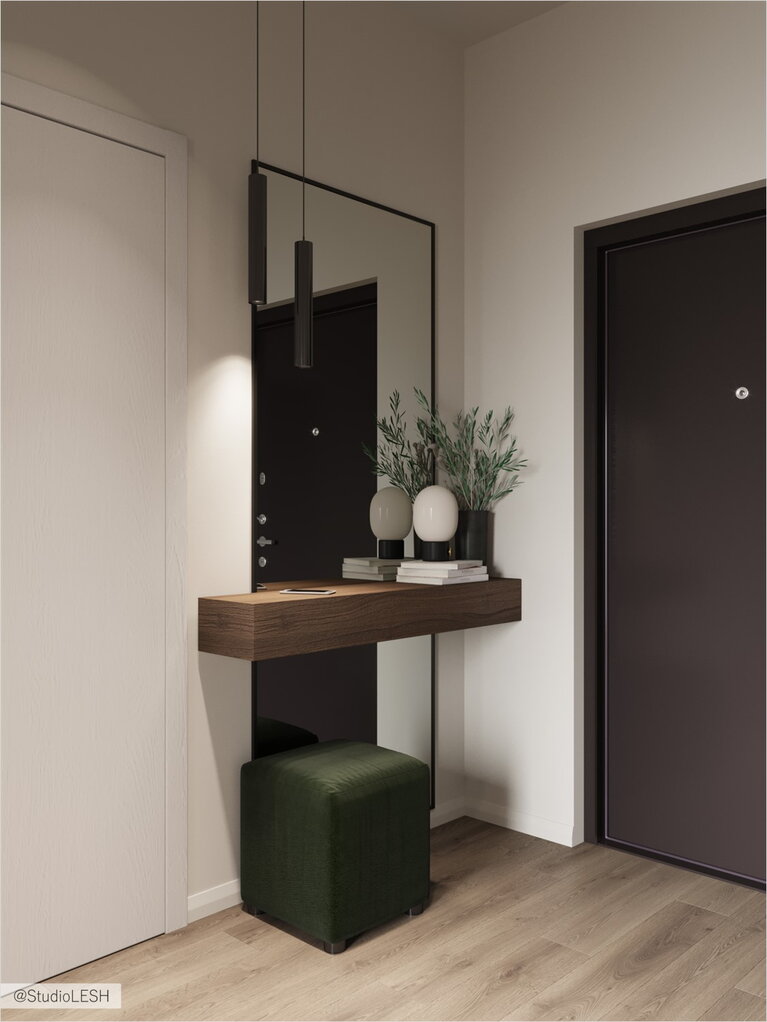 Floor mirror in the hallway and focus on the green ottoman