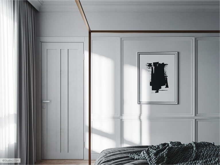 Light wall with additional art in the bedroom