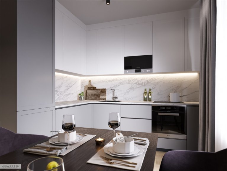  White corner kitchen with sleek facades