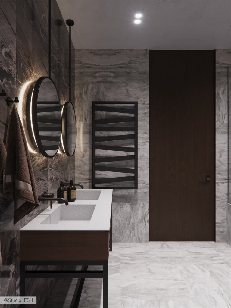 Bathroom in granite with round mirrors with lighting