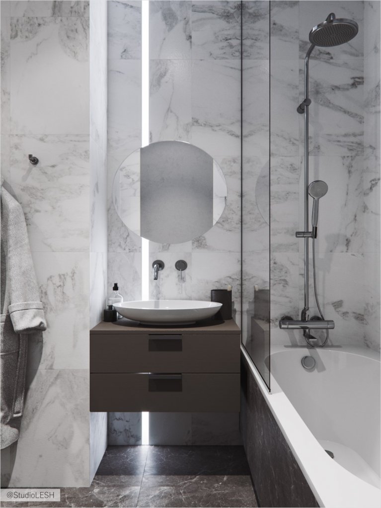 Bathroom in gray marble with round mirror