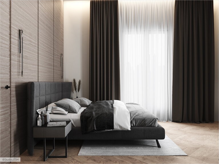 Double bed in a stylish bedroom and floor-to-ceiling doors