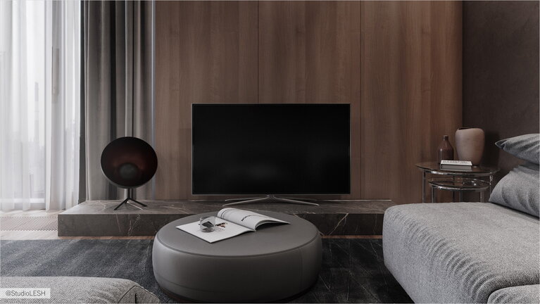 Телевизор в гостиной комнате с журнальным пуфиком 