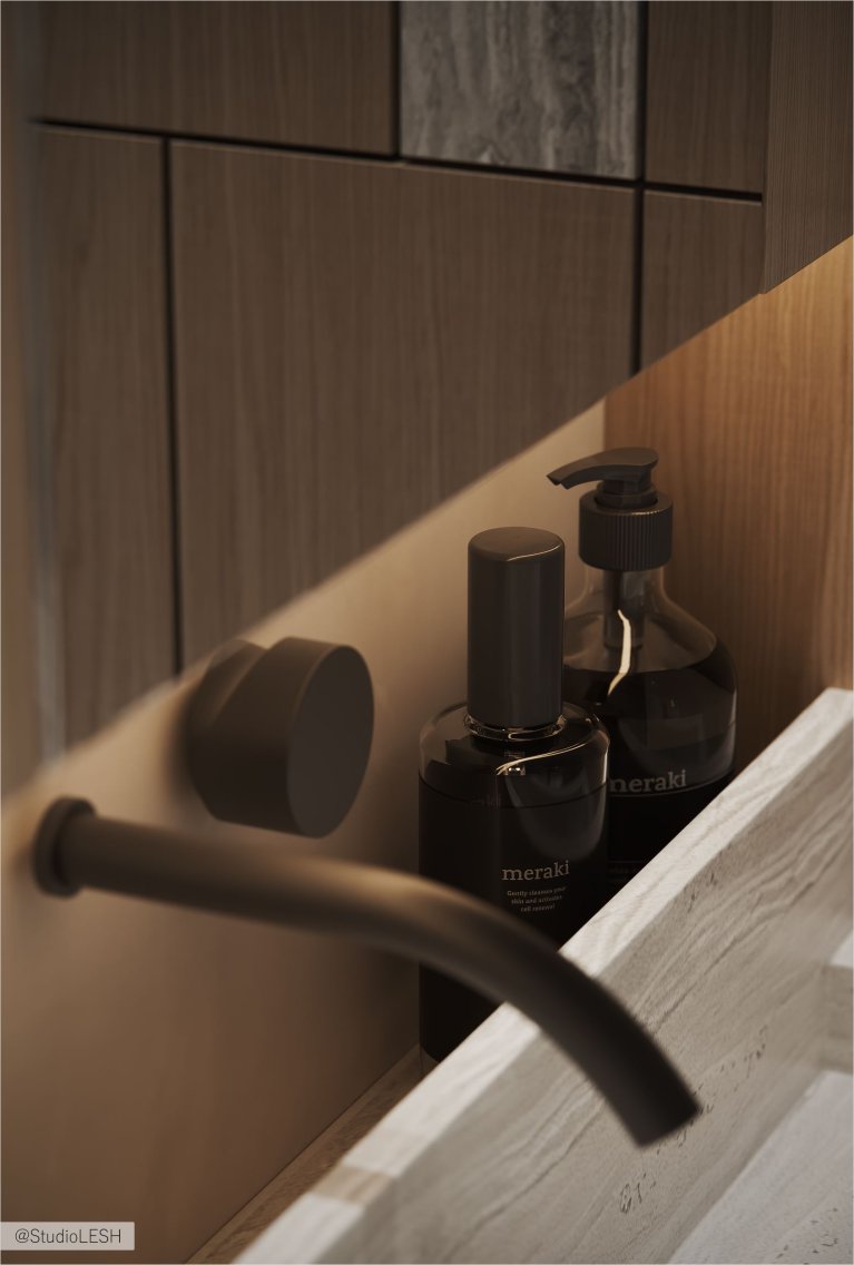 Интерьер современной ванной комнаты с подвесной каменной раковиной, смесителем, встроенным в стену, и деревянными панелями на стене.