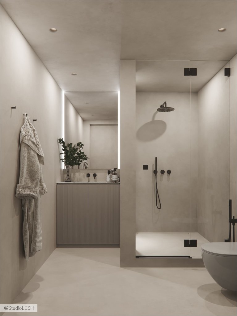 Интерьер современной ванной комнаты с белой ванной, душевой кабиной со стеклянными дверями, зеркалом с подсветкой и серыми стенами.